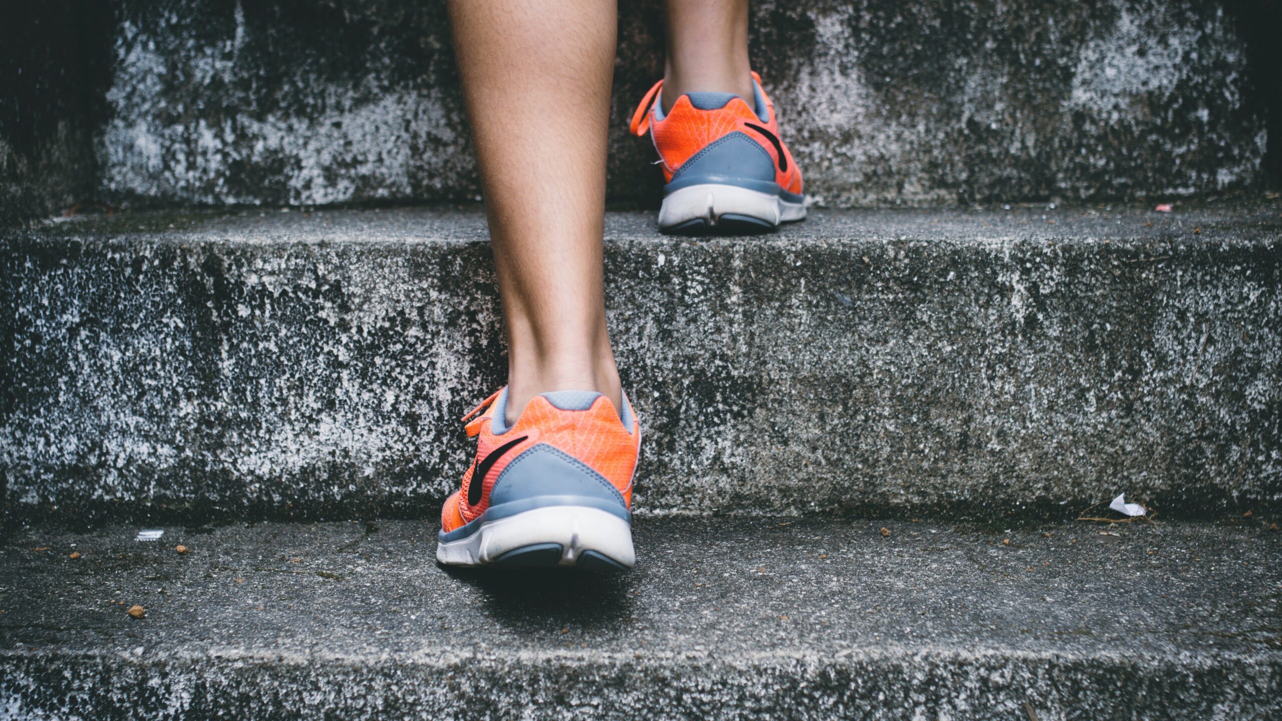 Closeup to the feet of someone running up the stairs