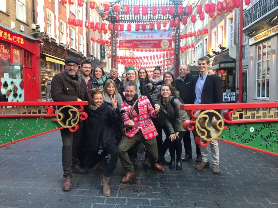 group of people posing for a picture in Chinatown