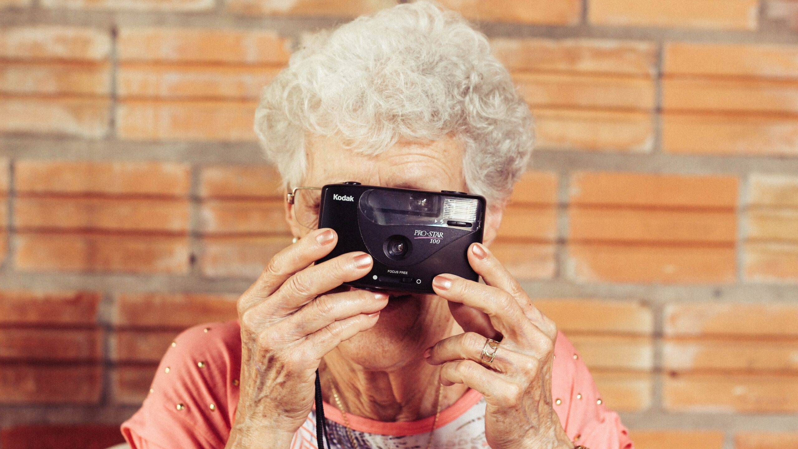 Elderly woman taking a photo